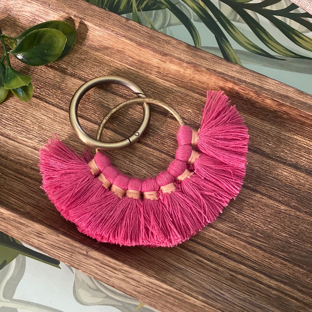 Gold keychain with pink fringe